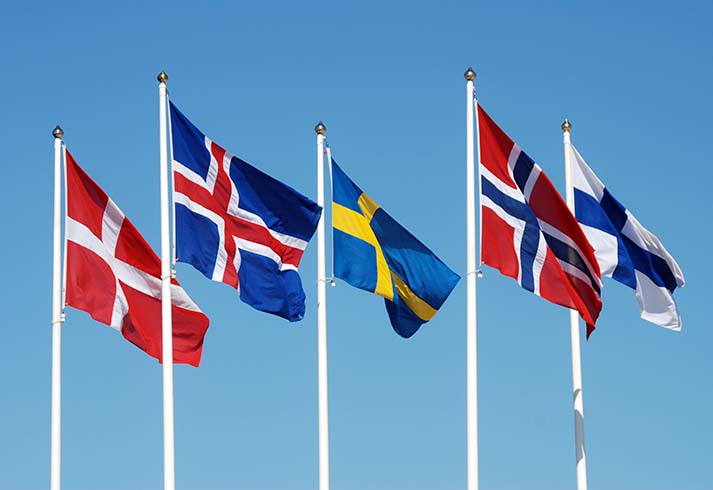 Scandinavian flags on a blue sky.